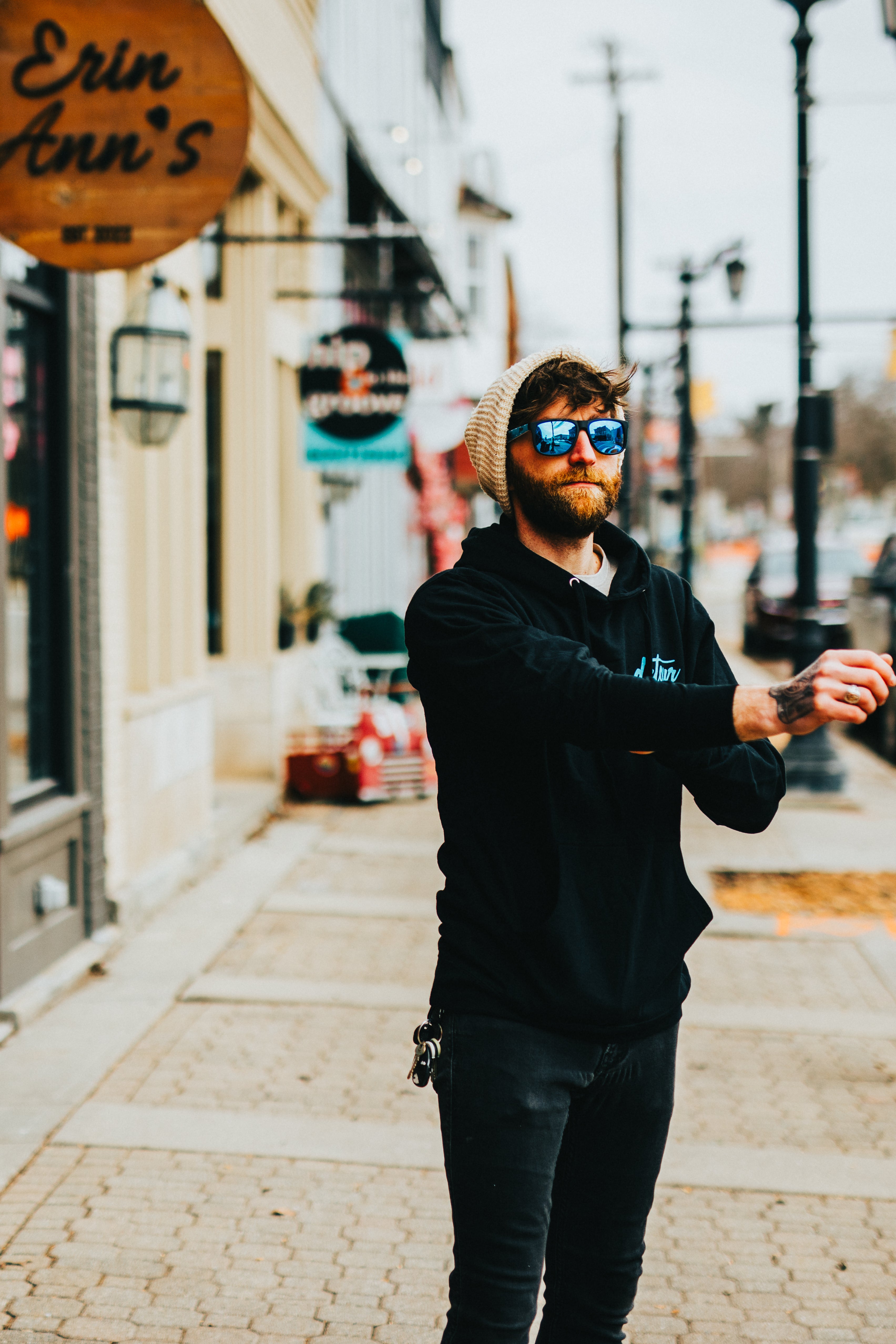 Snowboarder carving through powder in snowy terrain.